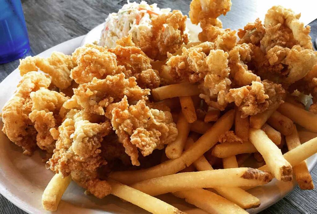 this is a prefix.Crispy fried seafood piled over golden French fries with creamy coleslaw on a platethis is a suffix.